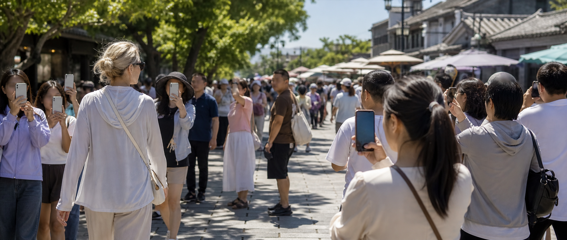A public street where an anonymous light-haired traveler draws unwanted attention